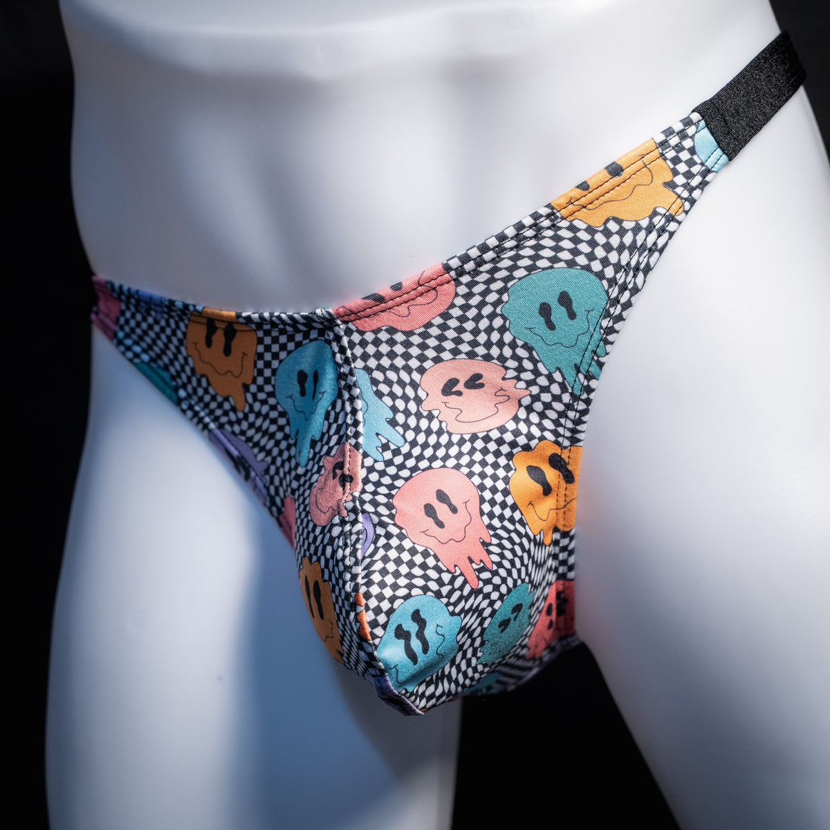 Men's melting faces thong underwear, classic cut, front view.