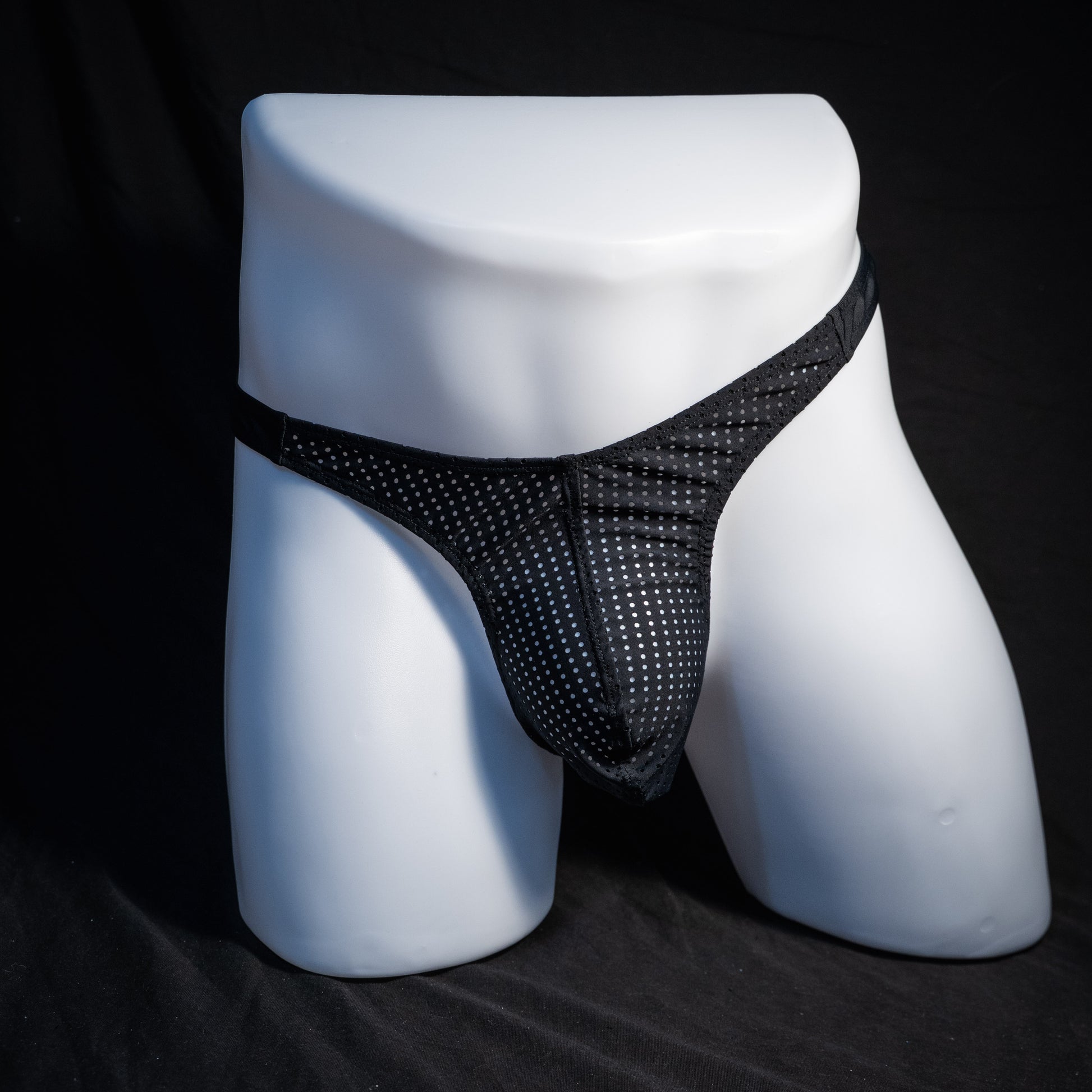 Men's mesh and cheetah print thong underwear, slim cut, front view.