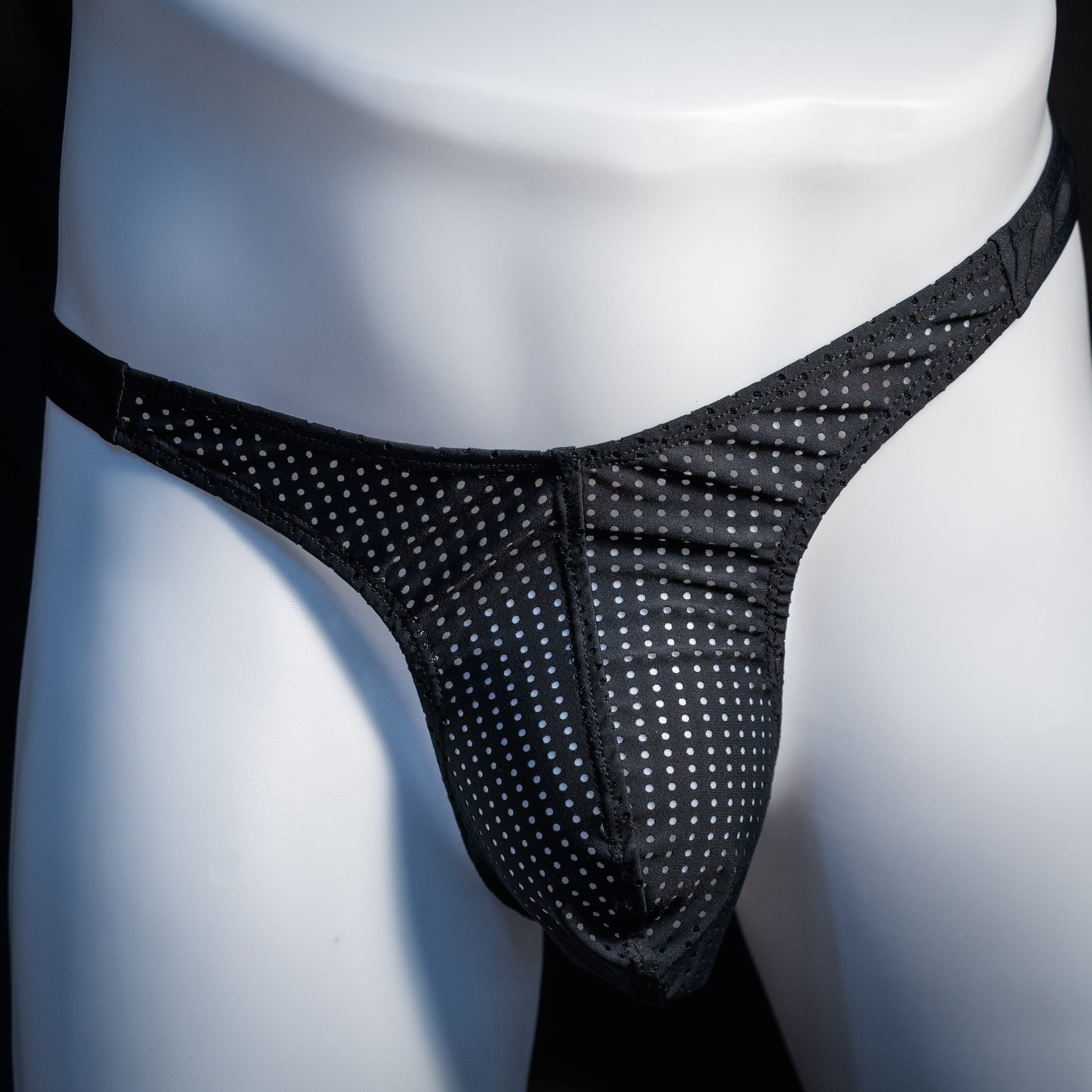 Men's mesh and cheetah print thong underwear, slim cut, front view.