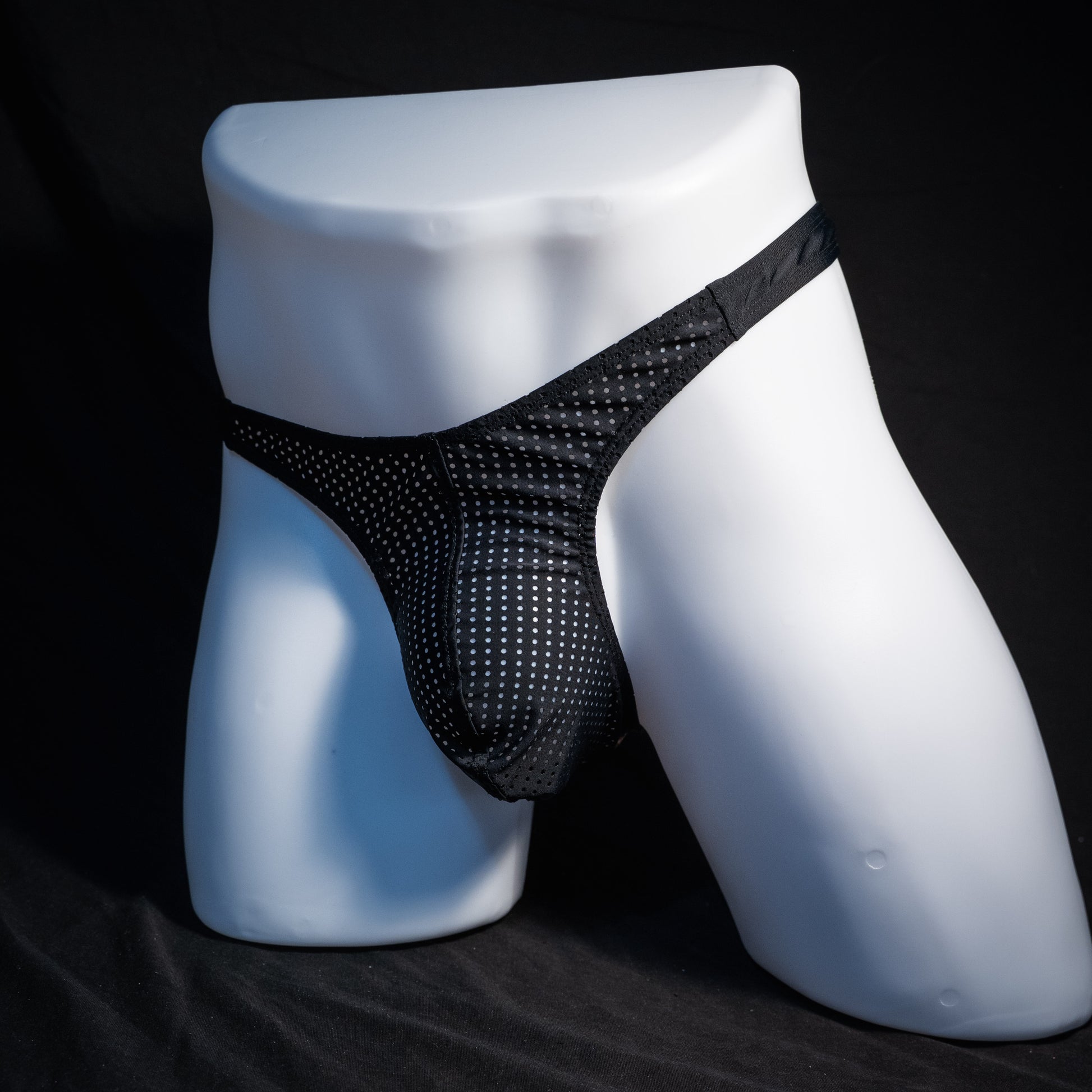 Men's mesh and cheetah print thong underwear, slim cut, front view.