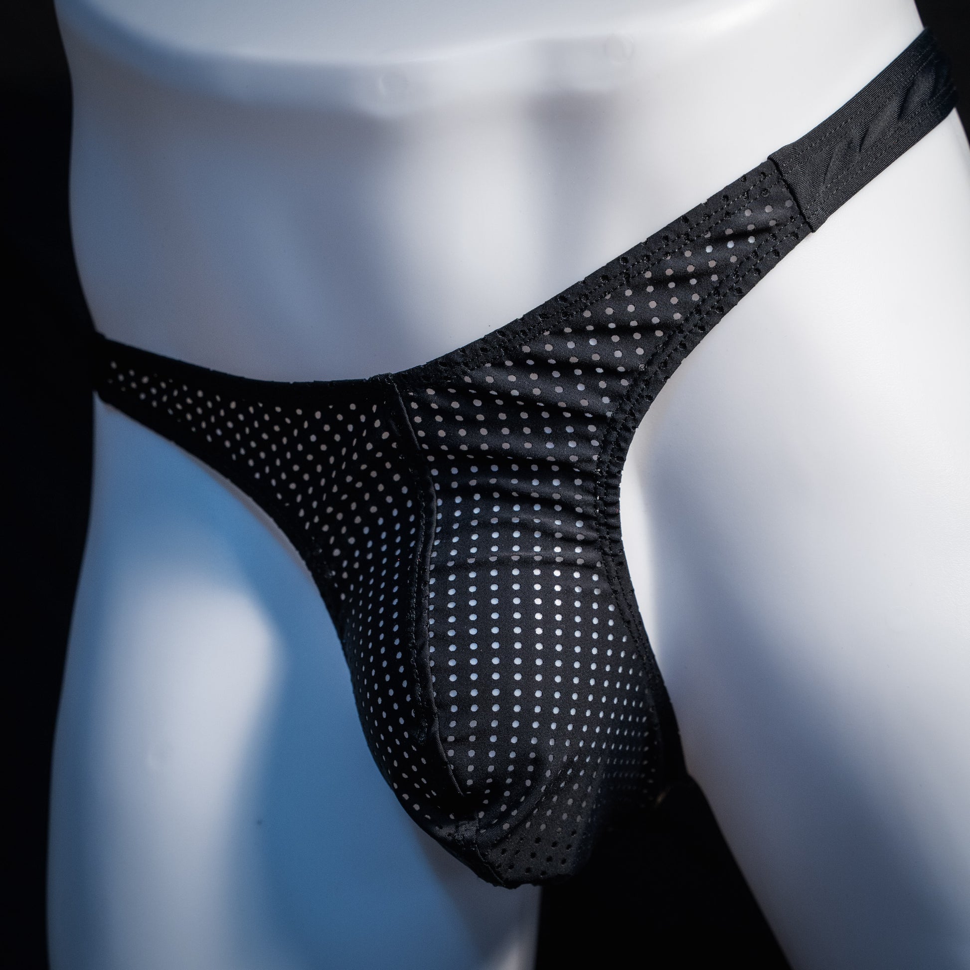 Men's mesh and cheetah print thong underwear, slim cut, front view.