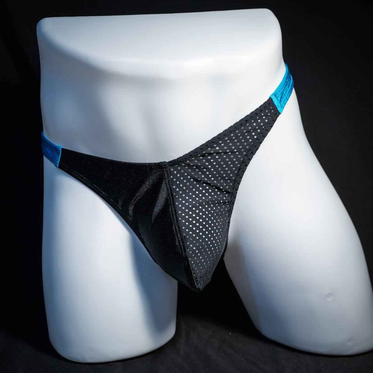 Men's black mesh and teal thong underwear, classic cut, front view.