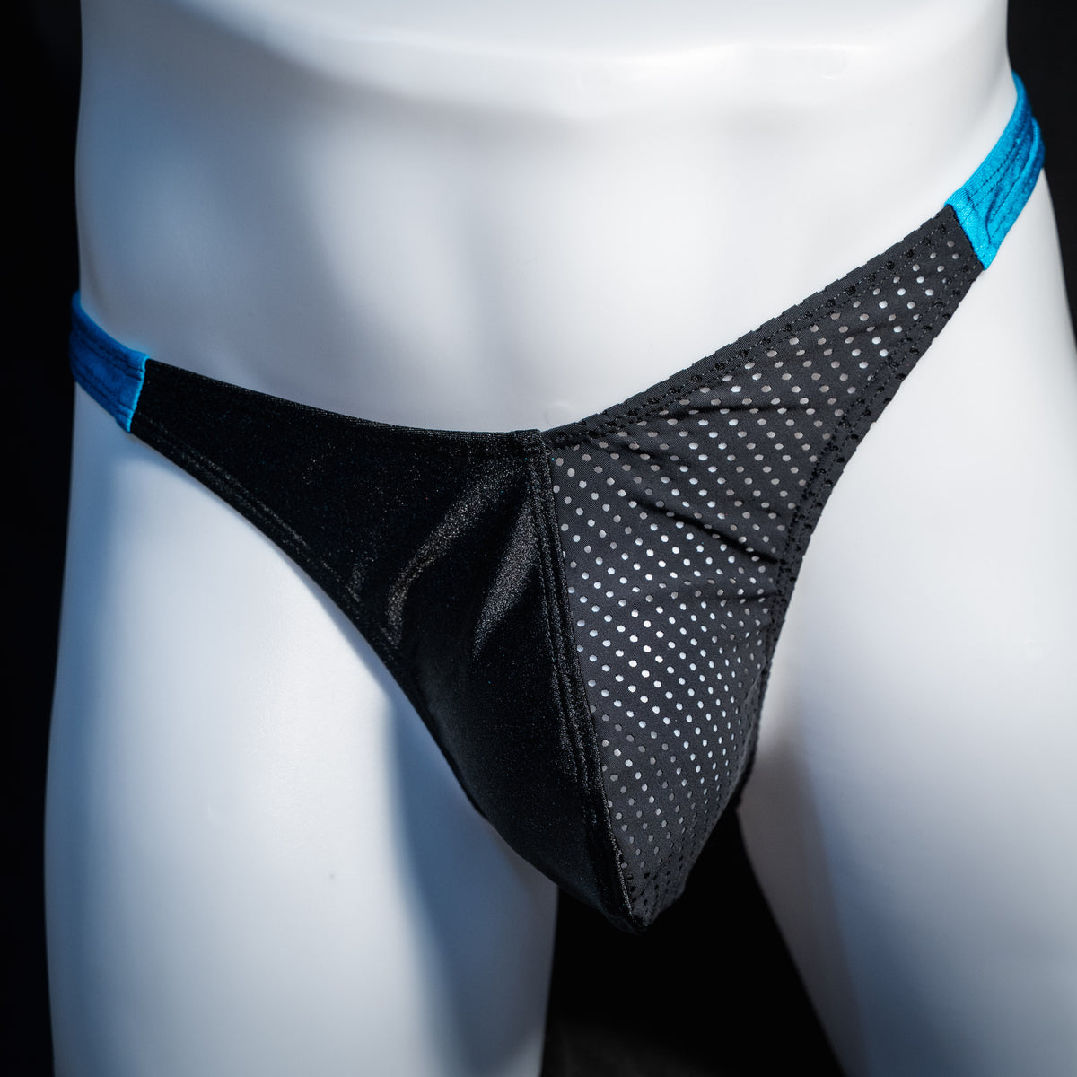 Men's black mesh and teal thong underwear, classic cut, front view.