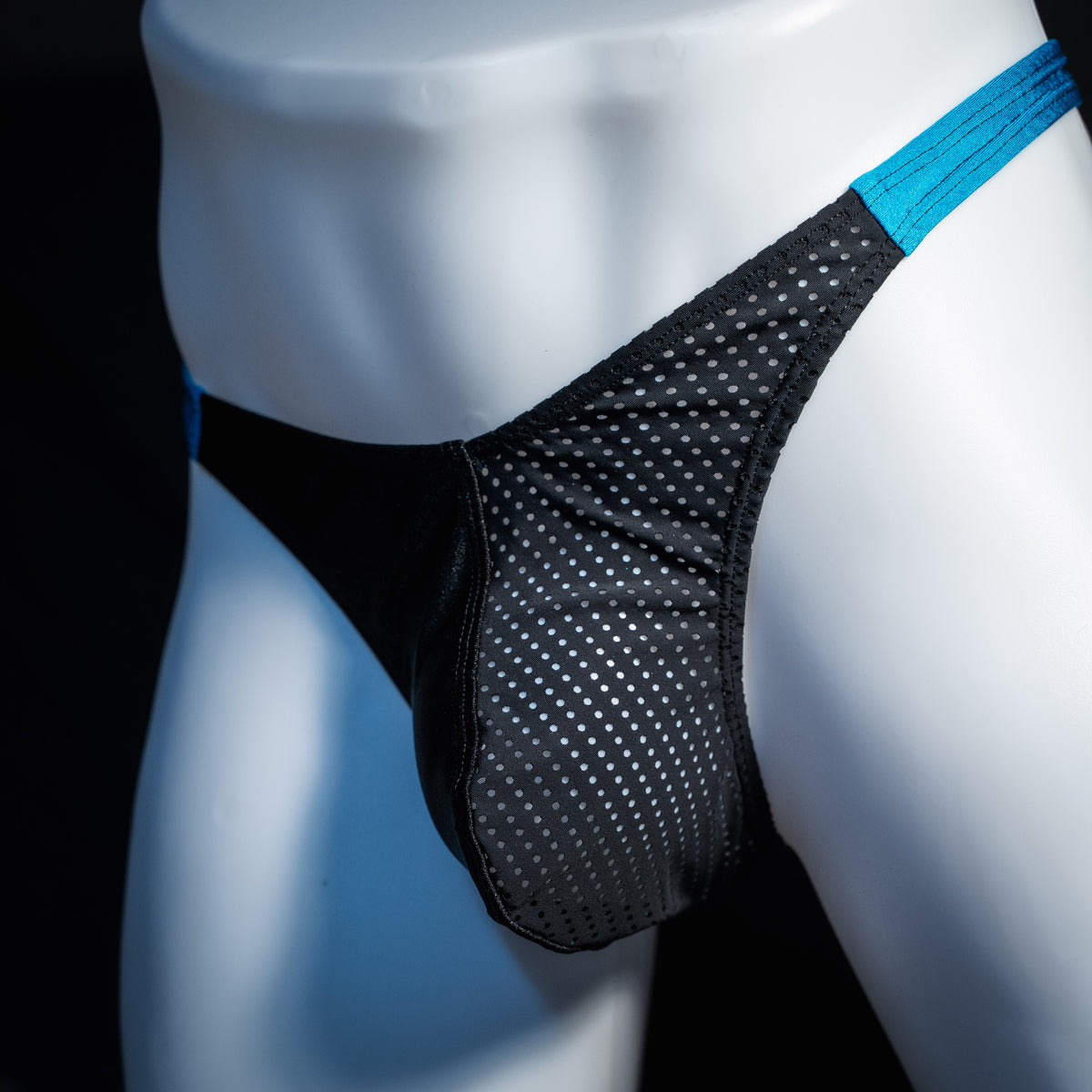Men's black mesh and teal thong underwear, classic cut, front view.