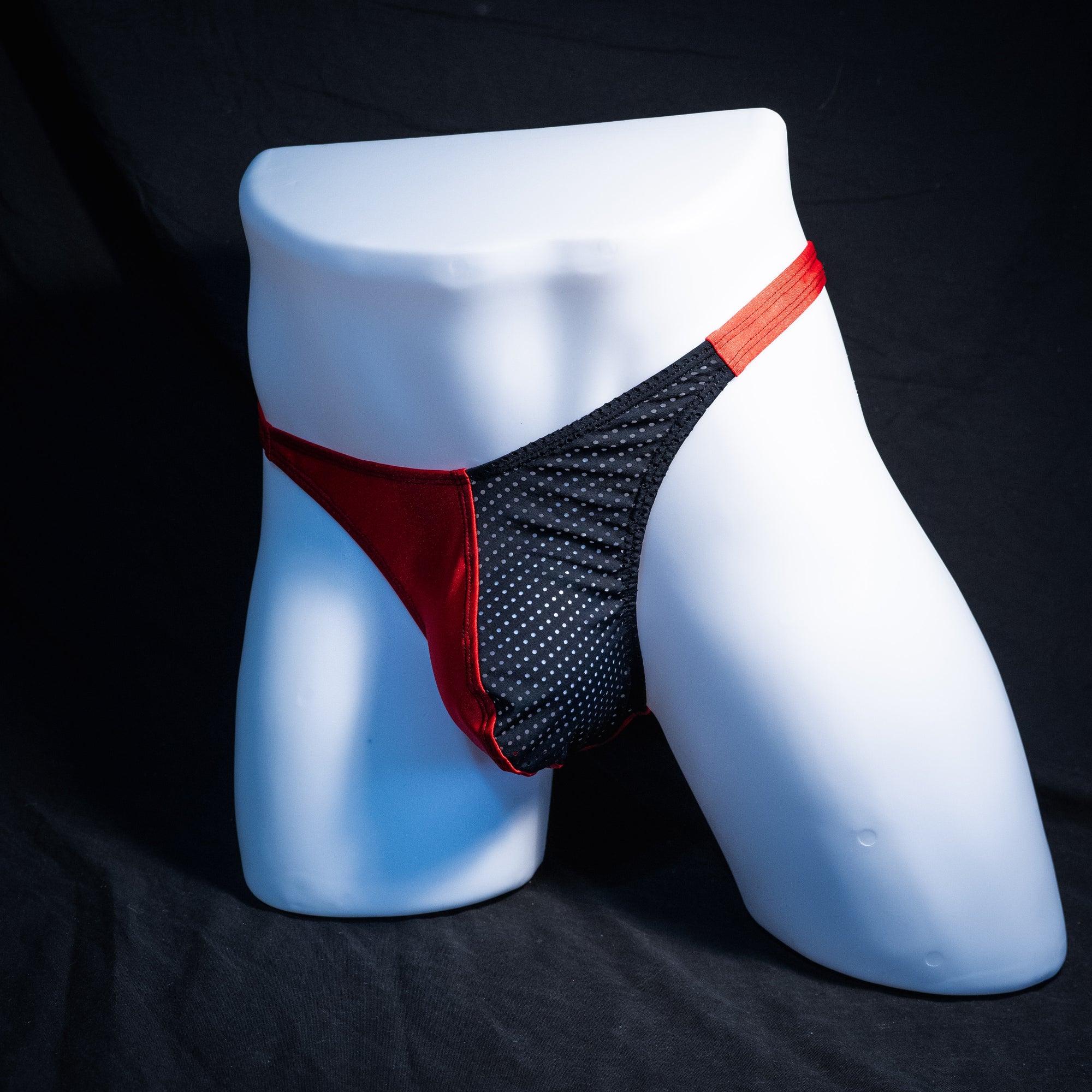 Men's red with black mesh thong underwear, classic cut, Full front angled view