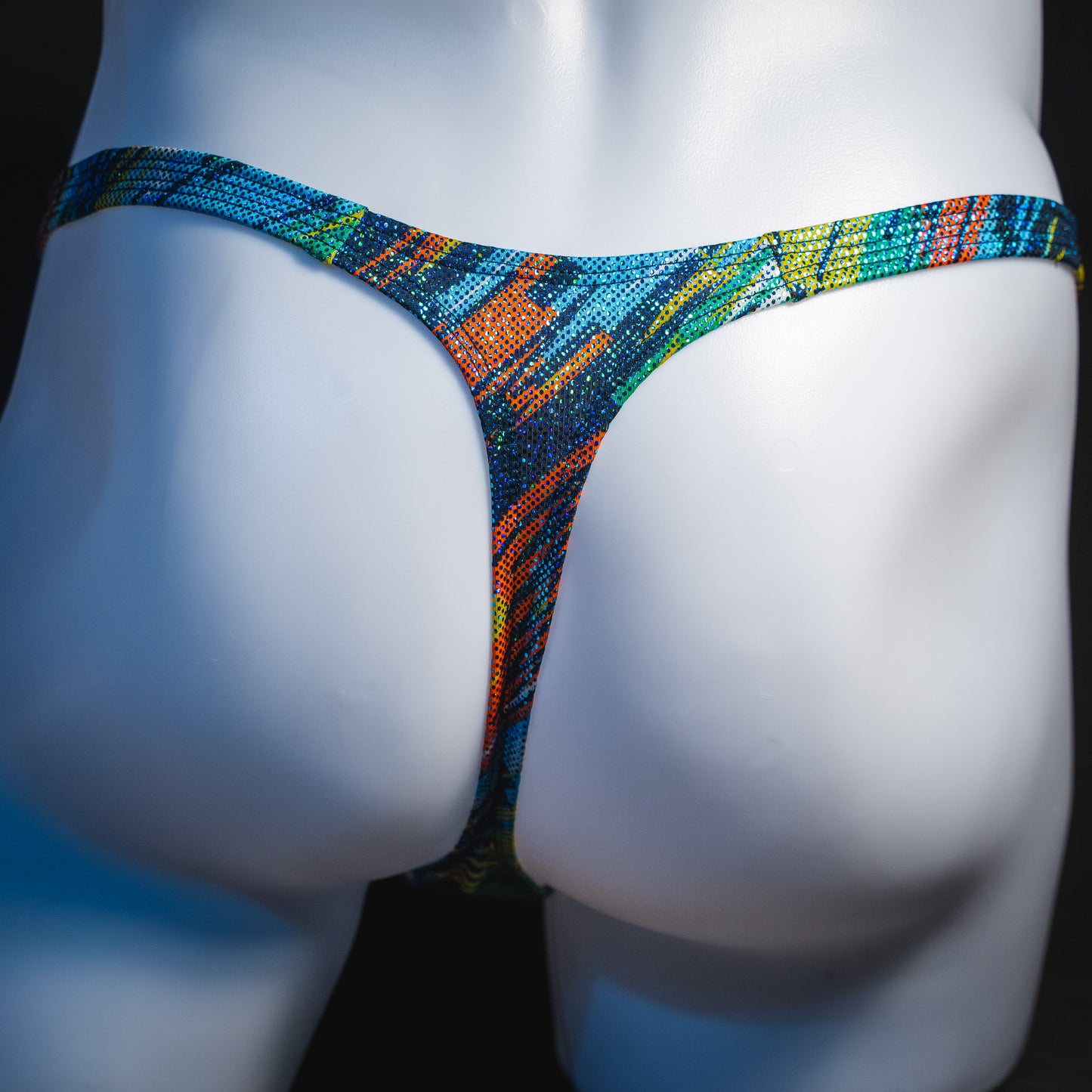 Men's metallic sparkle thong underwear, classic cut, rear view.