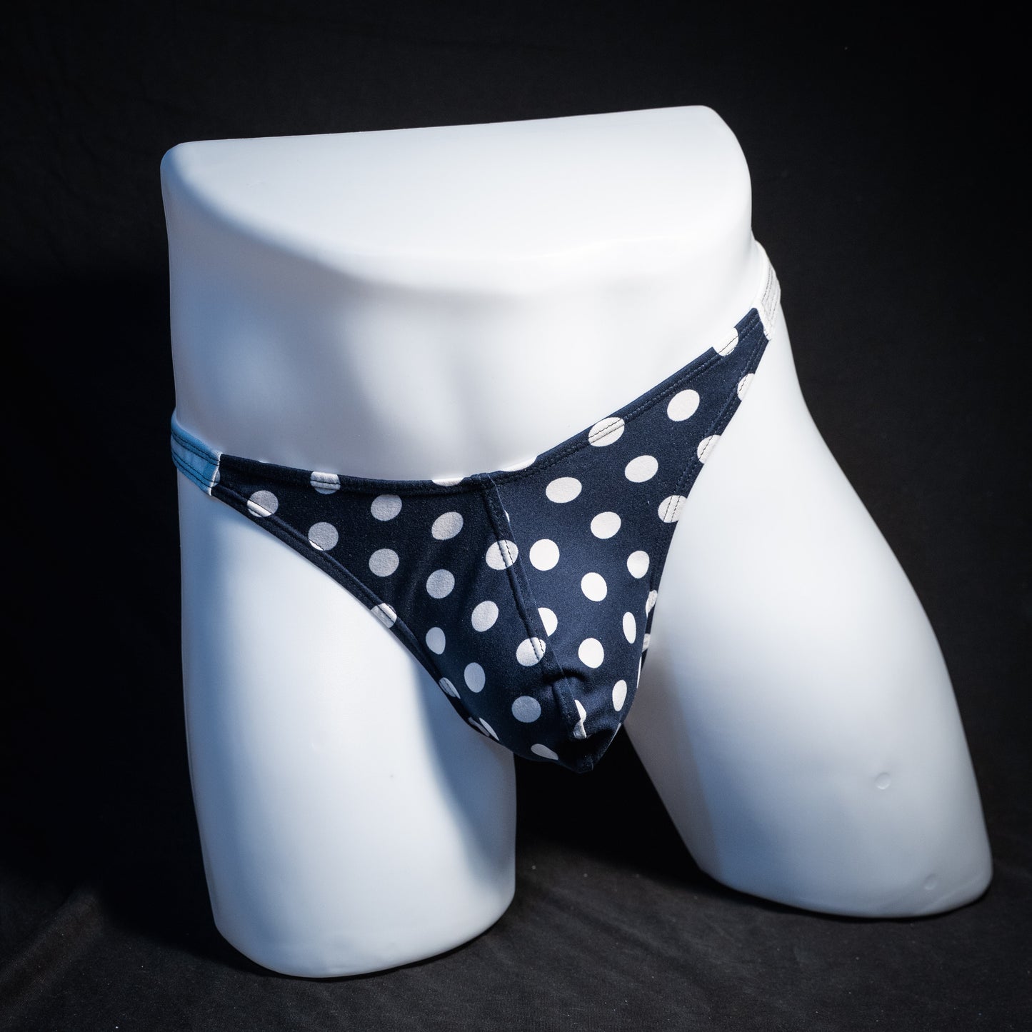 Men's navy blue and white thong underwear, classic cut, front view.