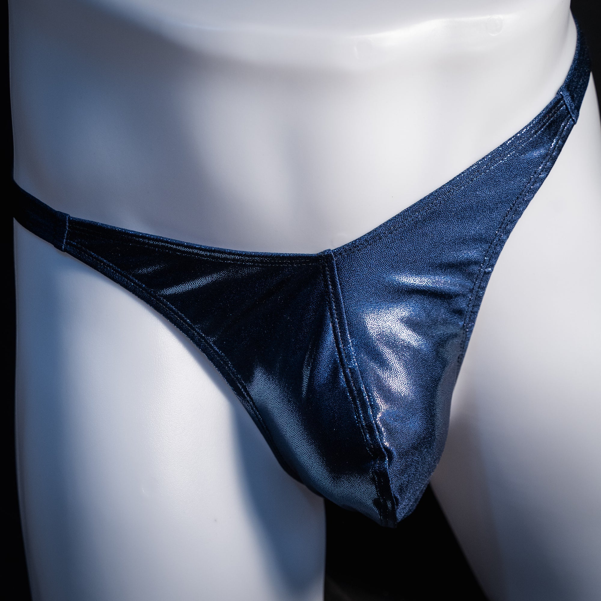 Men's navy blue metallic thong underwear, classic cut, front view.