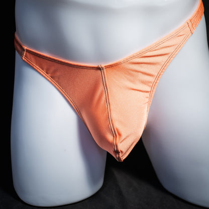 Men's neon orange thong underwear, classic cut, front view.