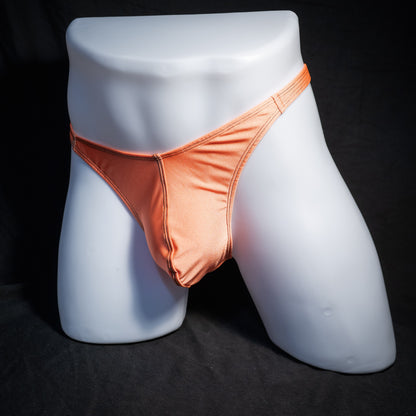 Men's neon orange thong underwear, classic cut, front view.