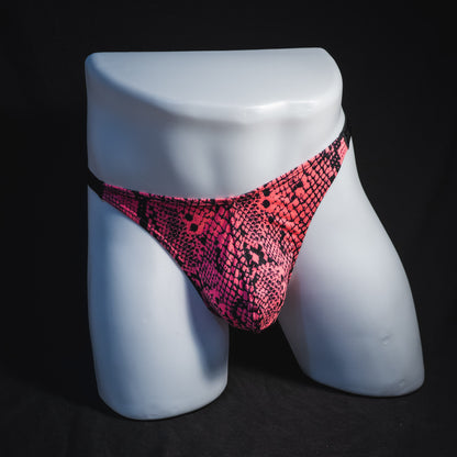 Men's neon pink snakeskin thong underwear, classic cut, full front view.