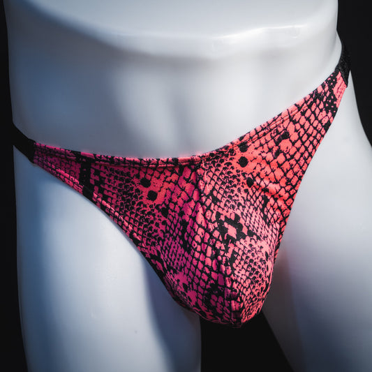 Men's neon pink snakeskin thong underwear, classic cut, front view.