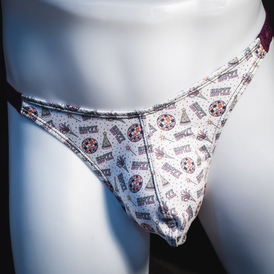 Men's new years thong underwear with shiny purple straps, classic cut, front view.