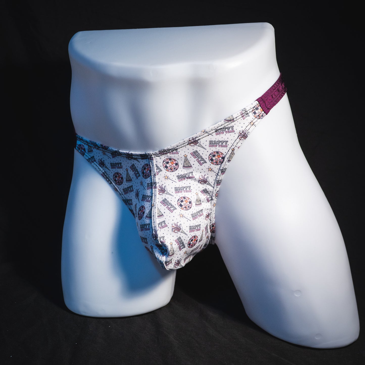 Men's new years thong underwear with shiny purple straps, classic cut, full angled front view.