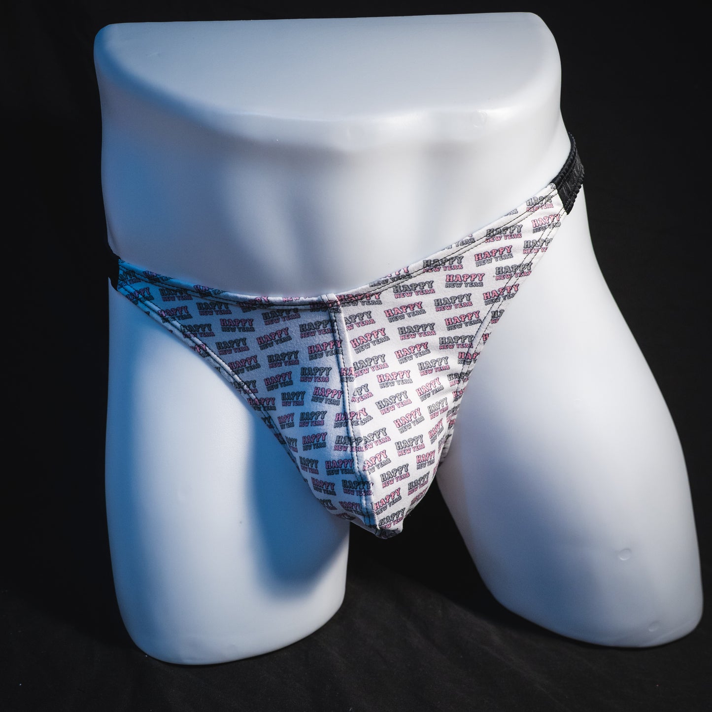 Men's new years thong underwear with black straps, classic cut, full front view.