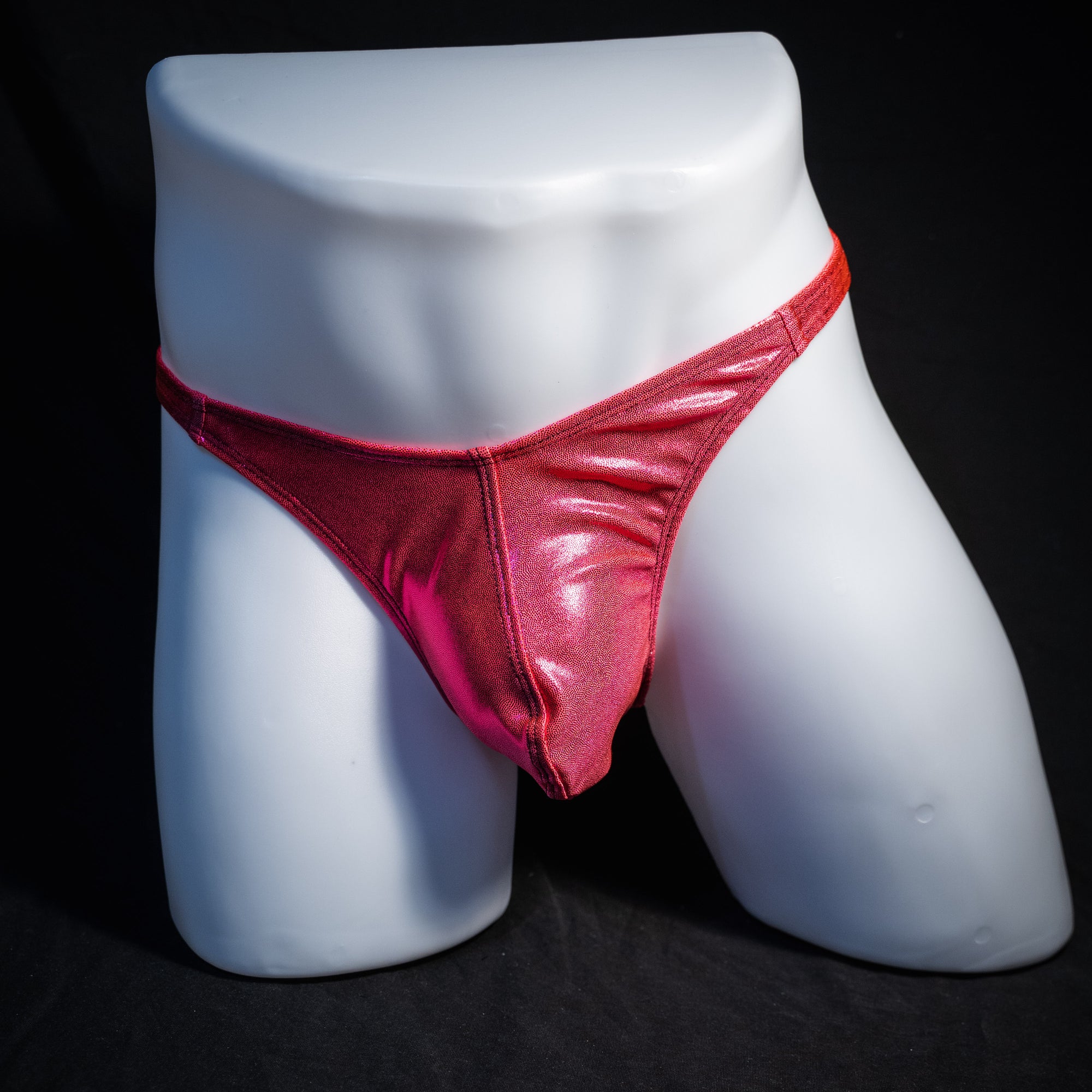 Men's orange fuchsia metallic thong underwear, classic cut, front view.