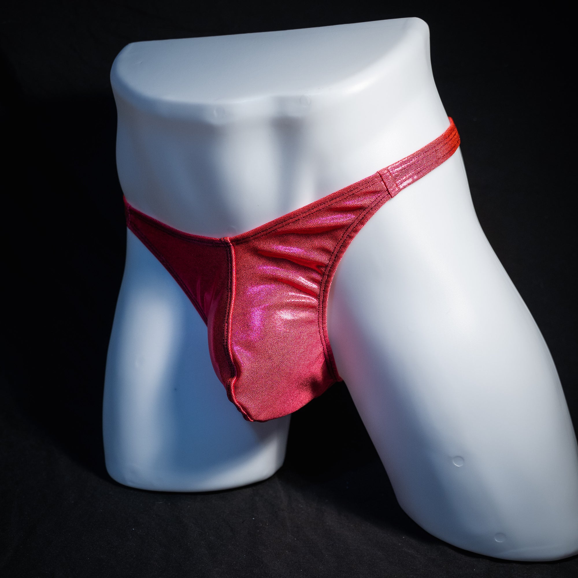 Men's orange fuchsia metallic thong underwear, classic cut, front view.