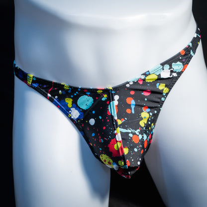Men's paint splatter thong underwear, classic cut, front view.