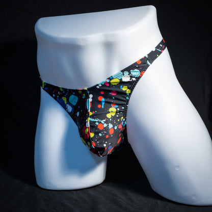 Men's paint splatter thong underwear, classic cut, front view.