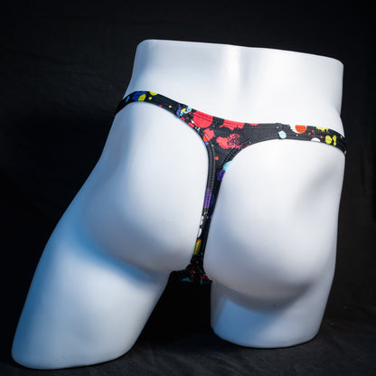 Men's paint splatter thong underwear, classic cut, rear view.