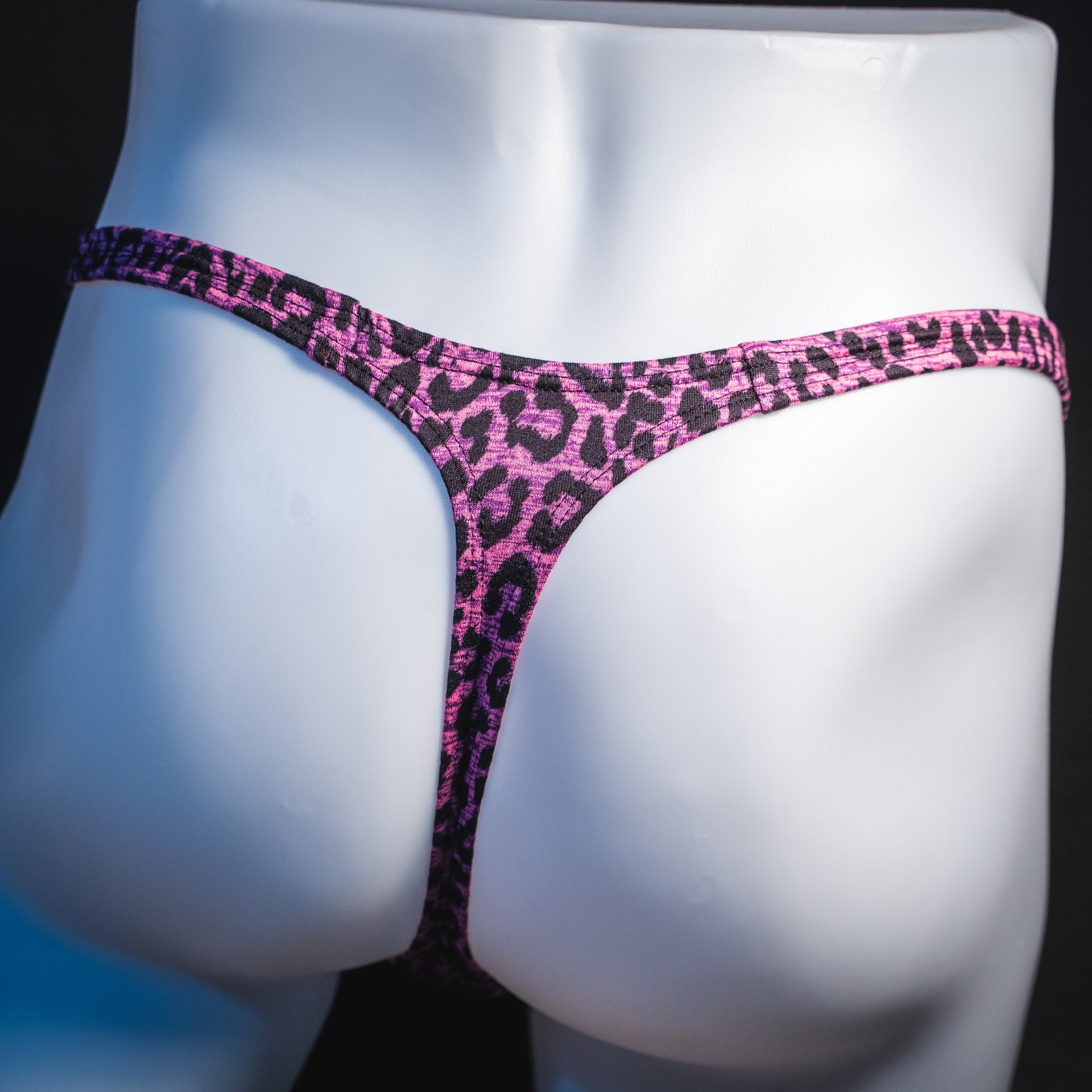 Men's pink leopard thong underwear, classic cut, rear view.