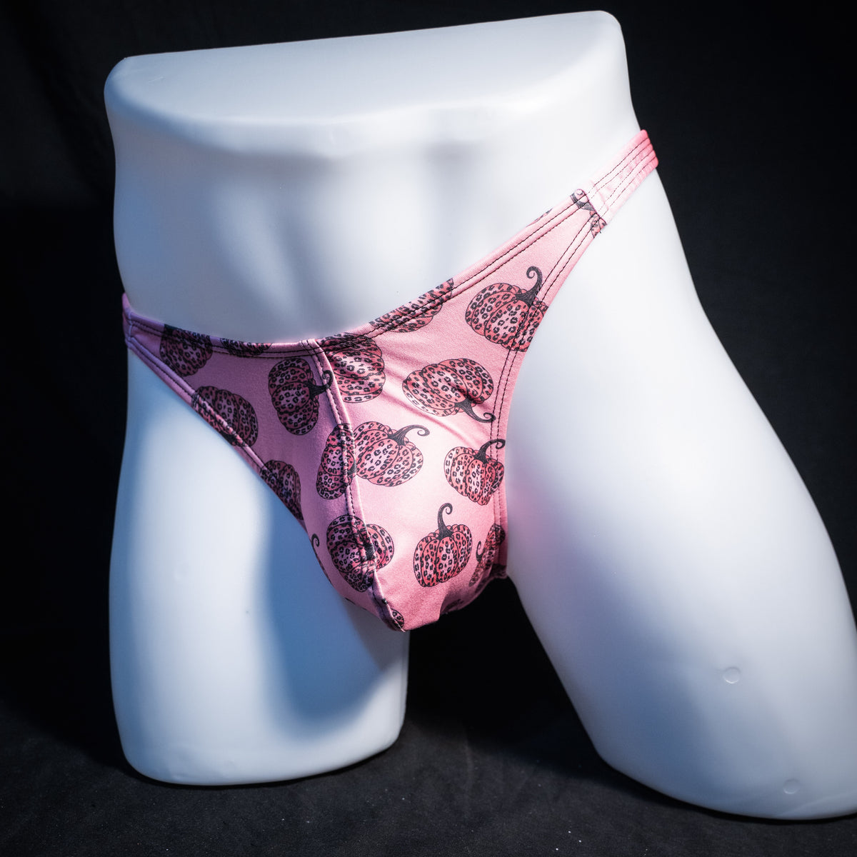 Men's pink pumpkins autumn thong underwear, classic cut, front view.