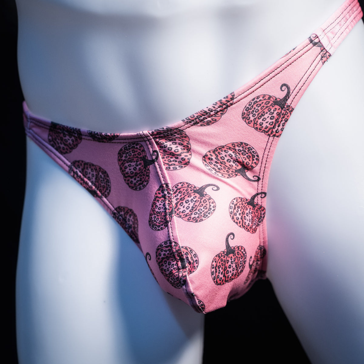 Men's pink pumpkins autumn thong underwear, classic cut, front view.