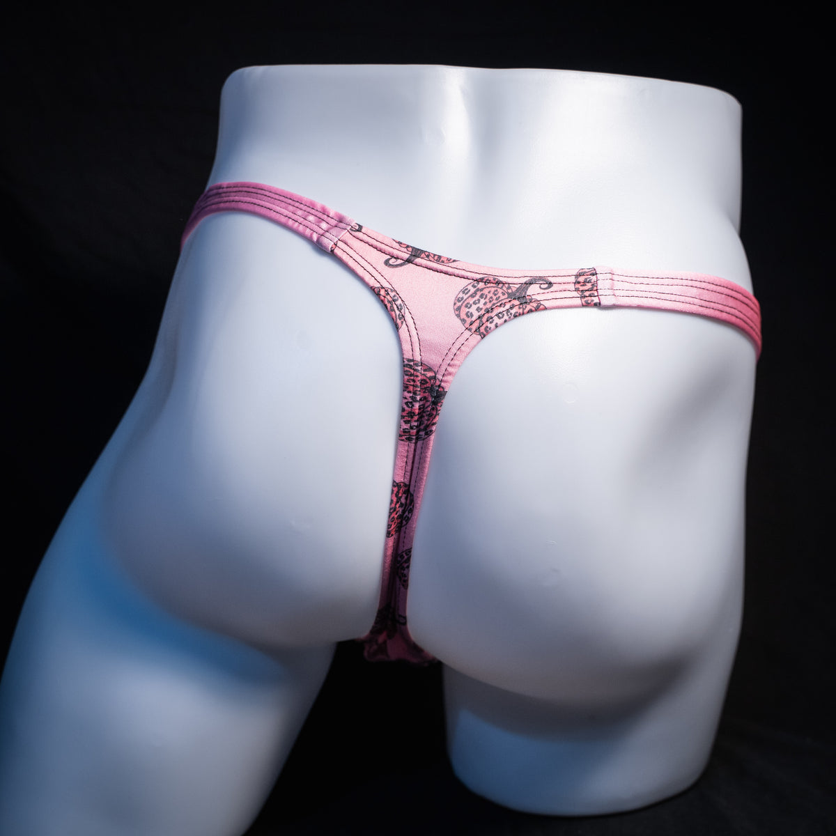 Men's pink pumpkins autumn thong underwear, classic cut, rear view.