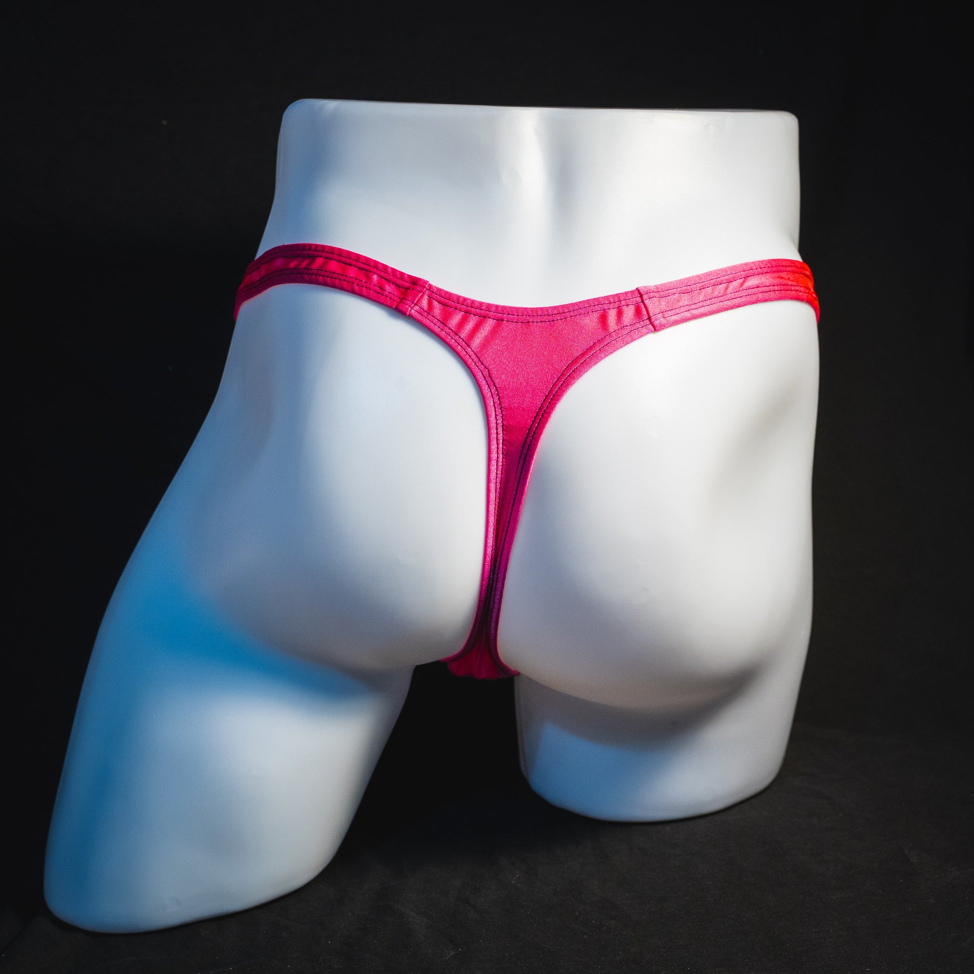 Men's pink leopard thong underwear, classic cut, full rear view.