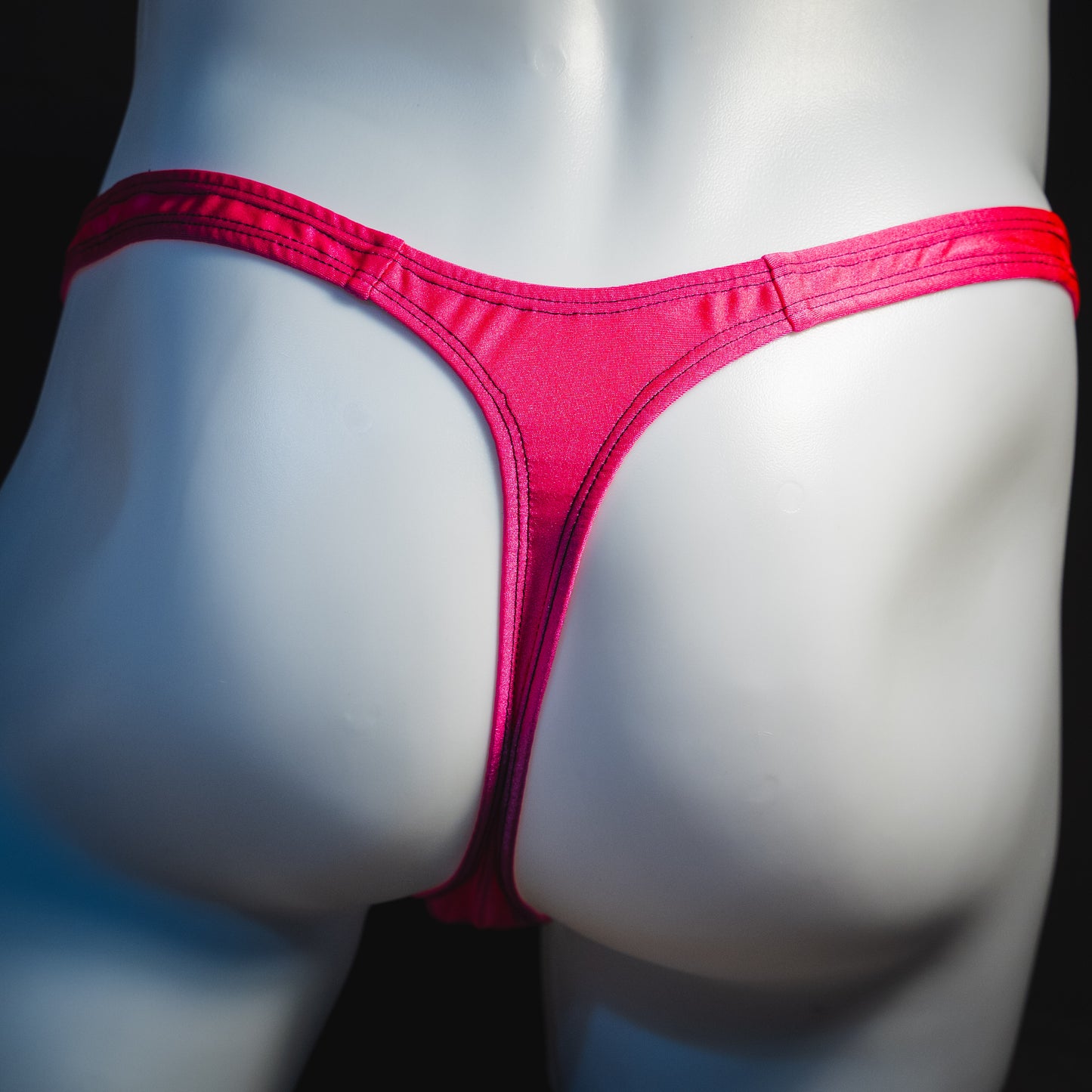Men's pink leopard thong underwear, classic cut, rear view.
