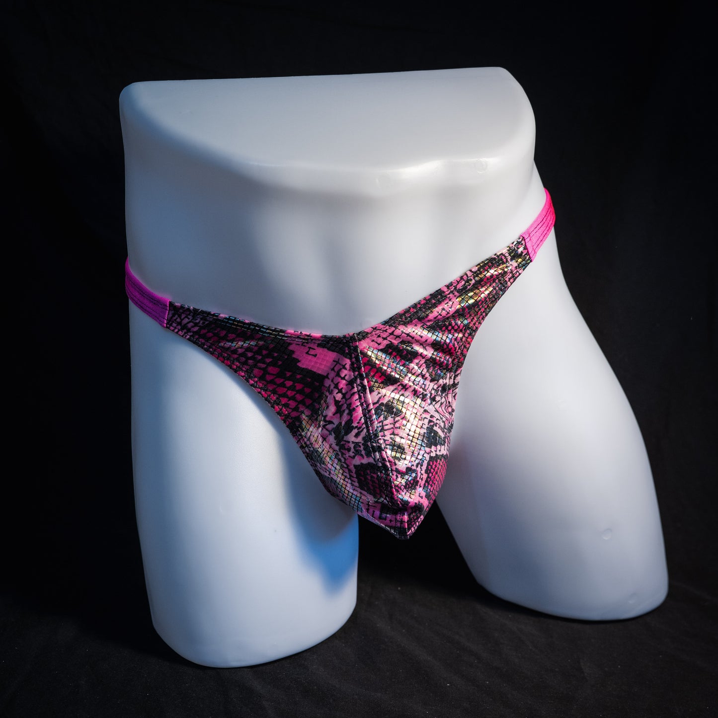 Men's pink metallic snakeskin thong underwear, classic cut, front view.
