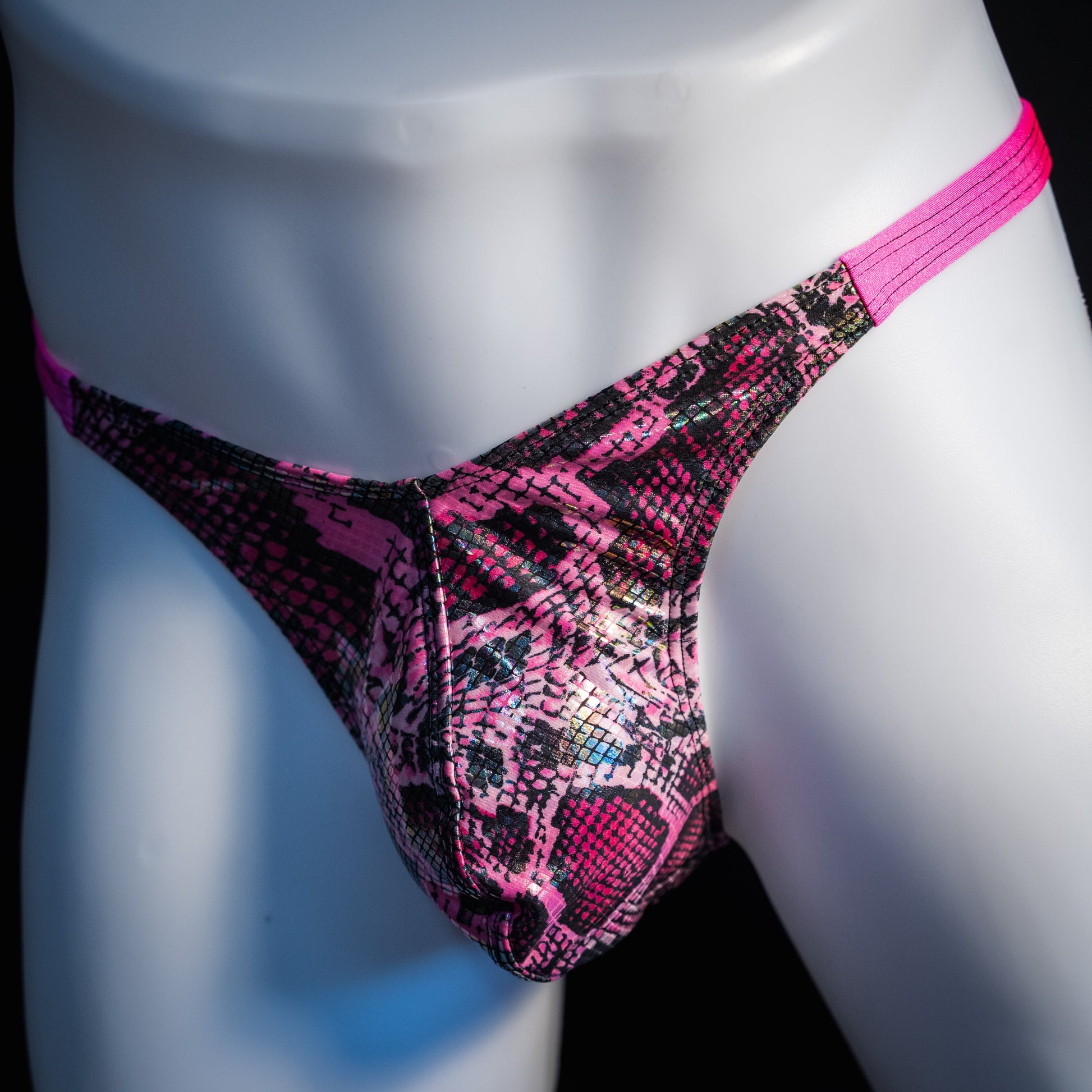 Men's pink metallic snakeskin thong underwear, classic cut, front view.