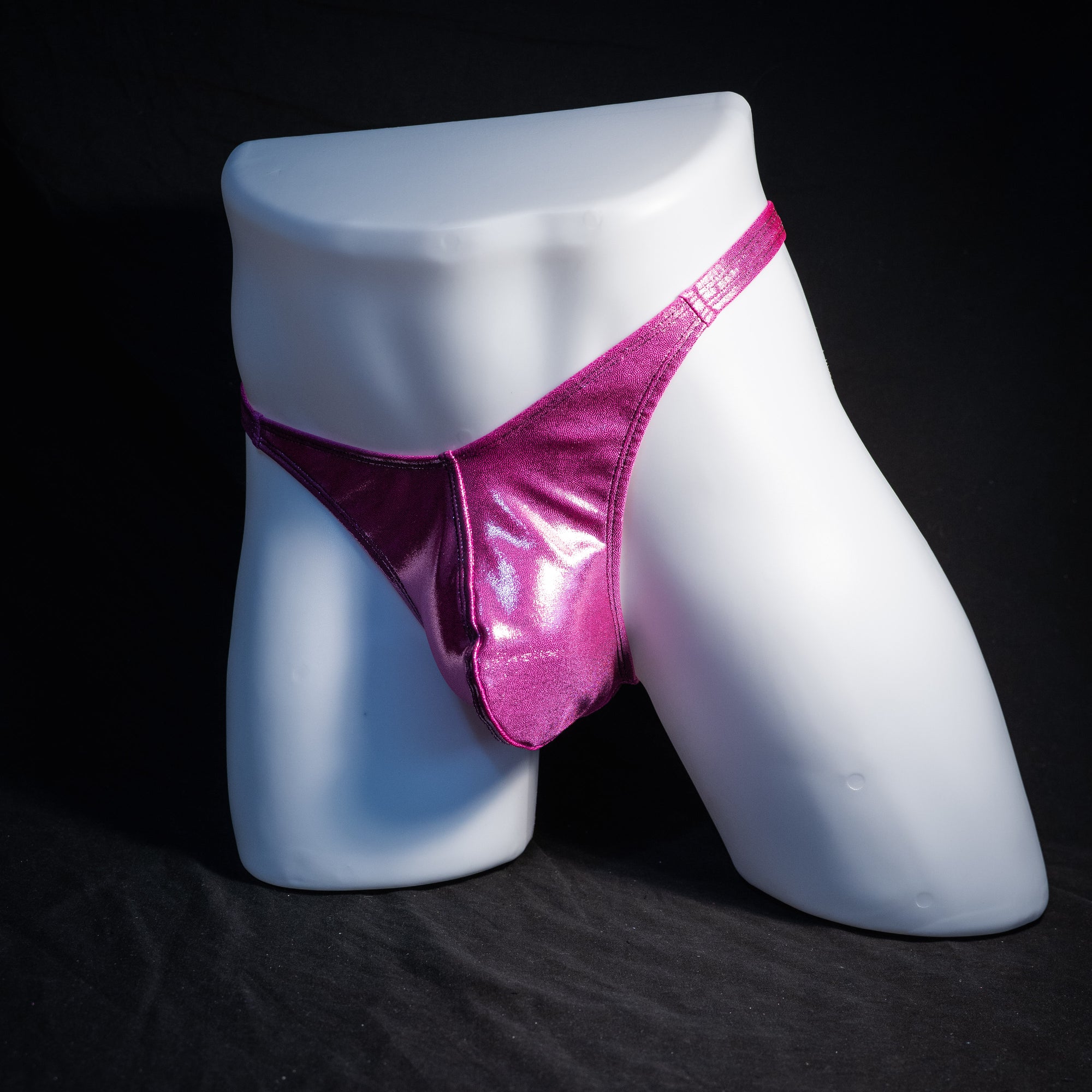 Men's pink metallic thong underwear, classic cut, front view.