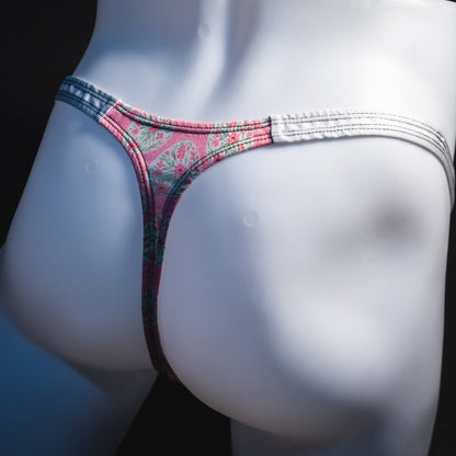 Men's pink painted easter eggs thong underwear, classic cut, angled rear view.
