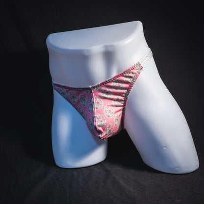 Men's pink painted easter eggs thong underwear, classic cut, full angled front view.