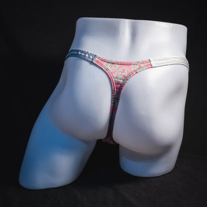 Men's pink painted easter eggs thong underwear, classic cut, full rear view.