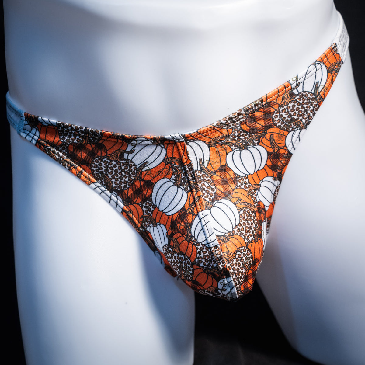 Men's pumpkin themed thong underwear, classic cut, front view.