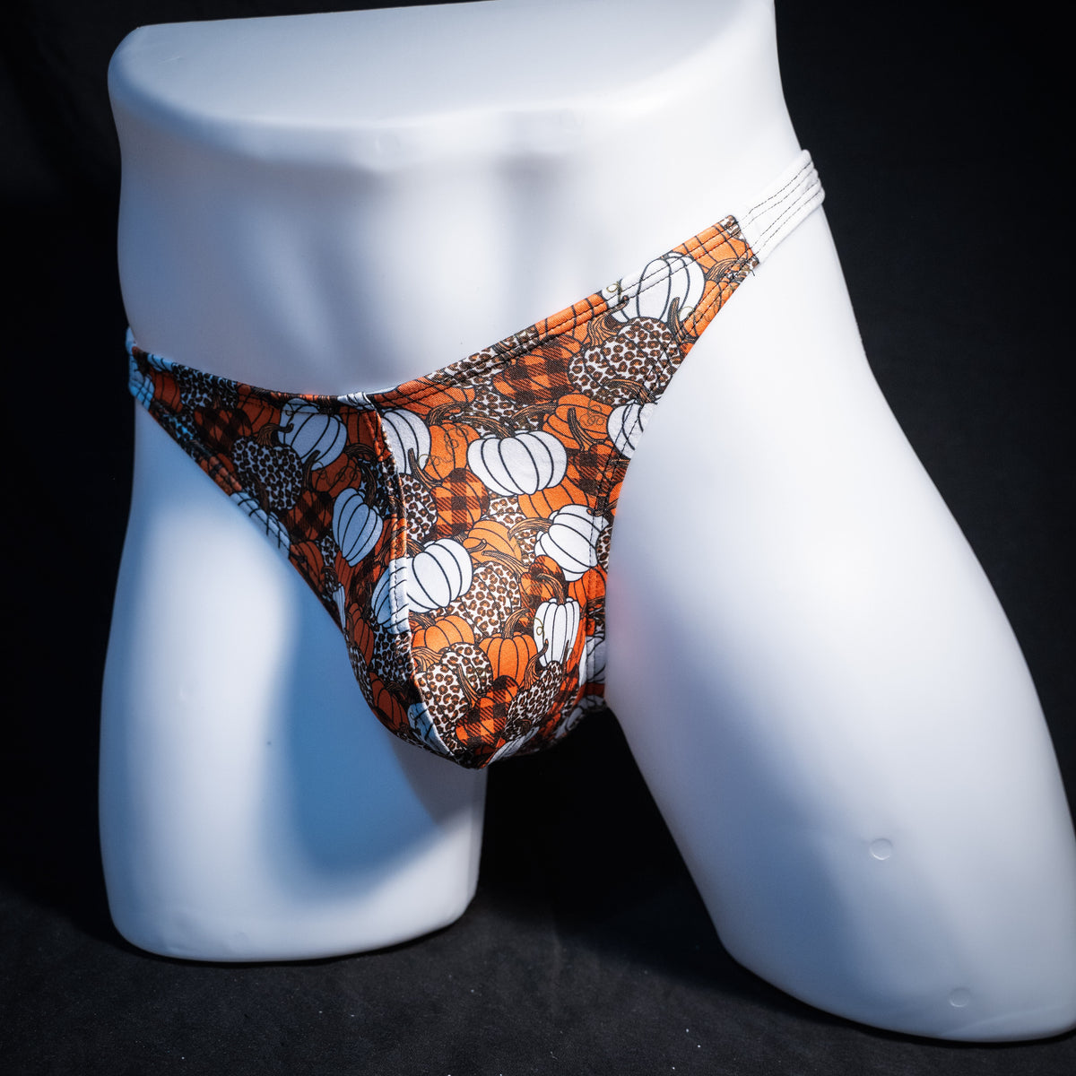 Men's pumpkin themed thong underwear, classic cut, front view.