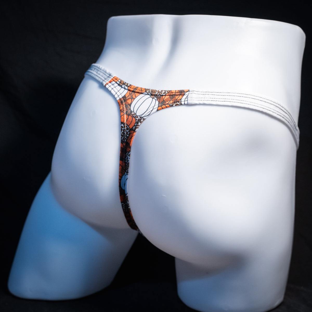 Men's pumpkin themed thong underwear, classic cut, rear view.