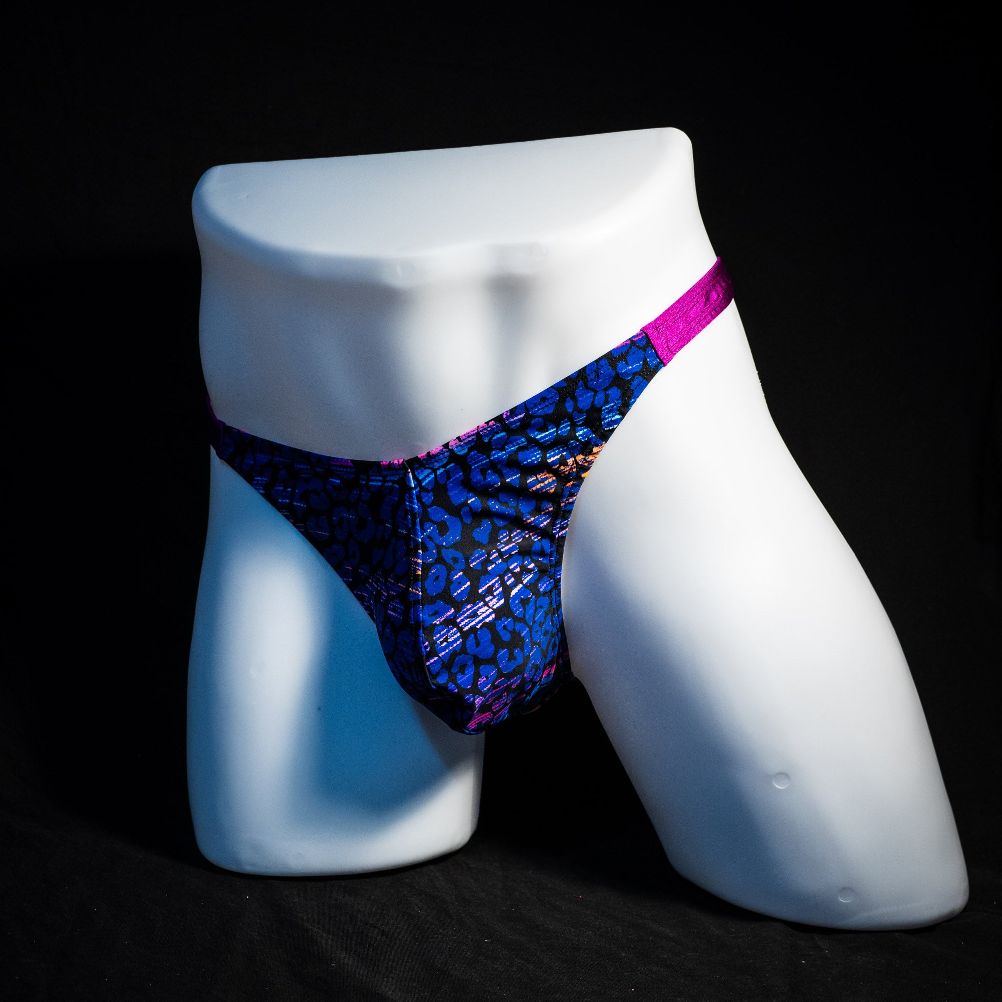 Men's purple and blue thong underwear, classic cut, full front angled view.