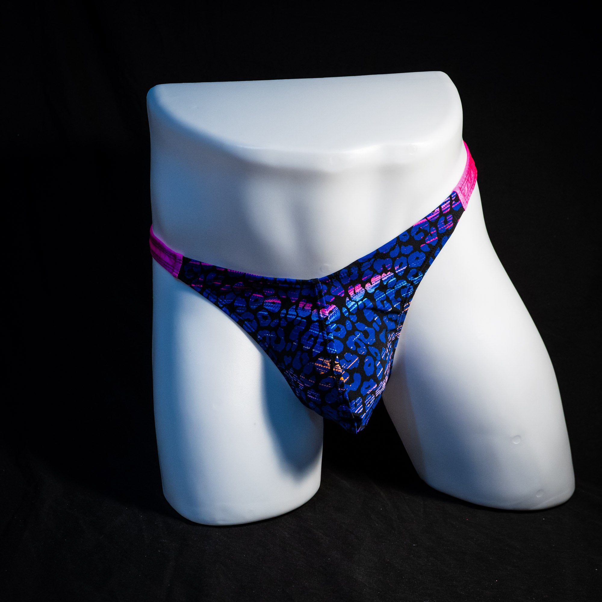 Men's purple and blue cheetah thong underwear, classic cut, full front view.