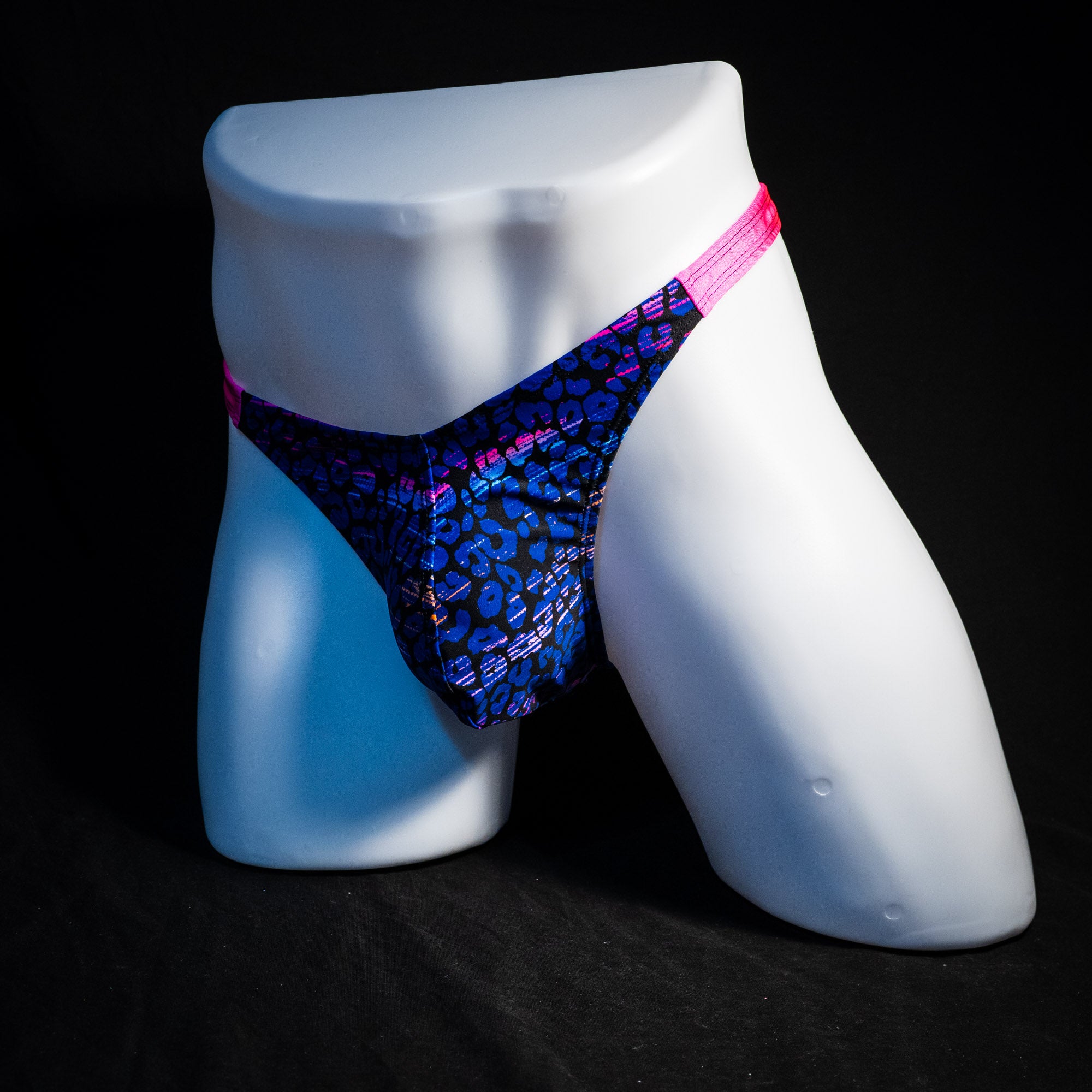 Men's purple and blue cheetah thong underwear, classic cut, full front angled view.