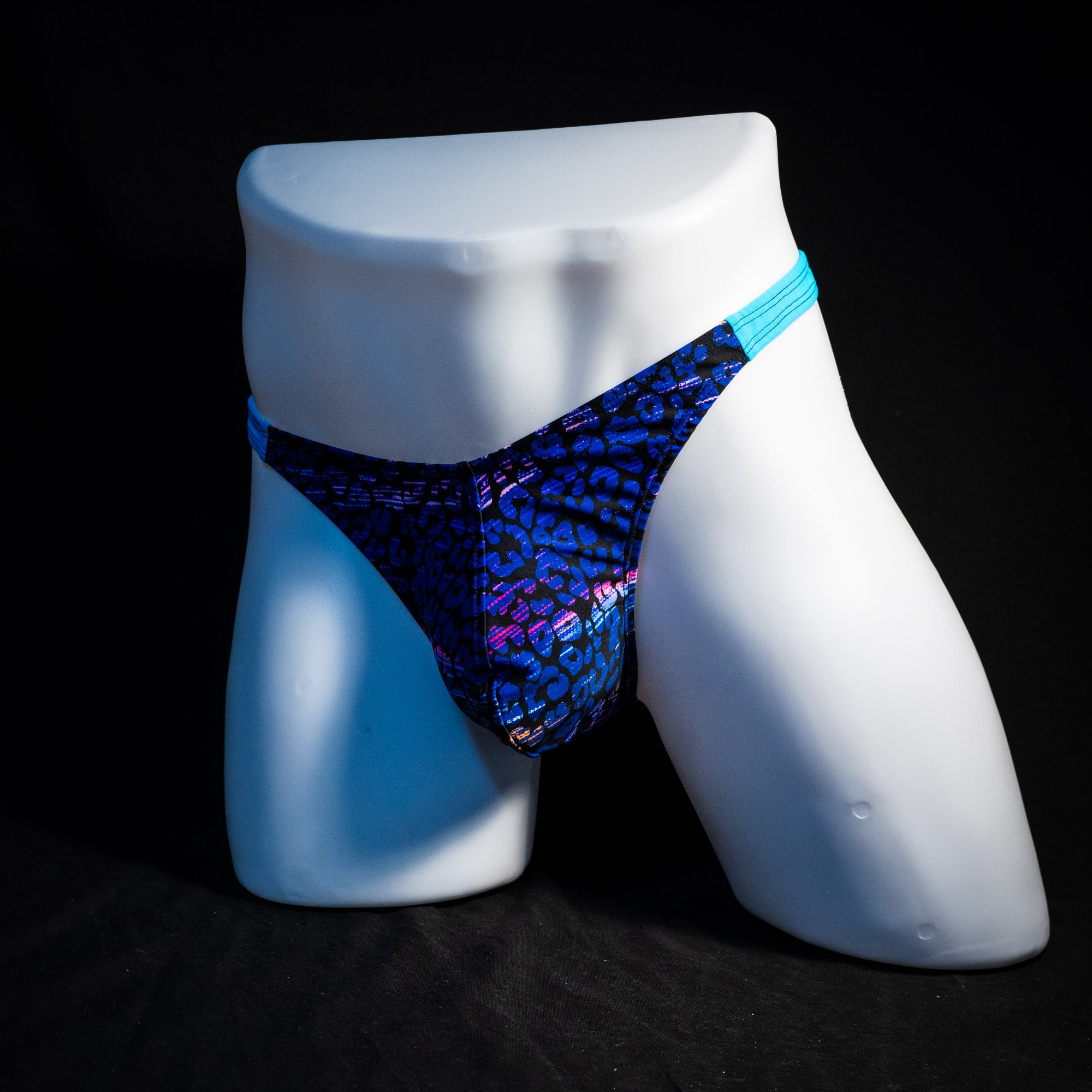 Men's purple and blue cheetah thong underwear, classic cut, full front angled view.