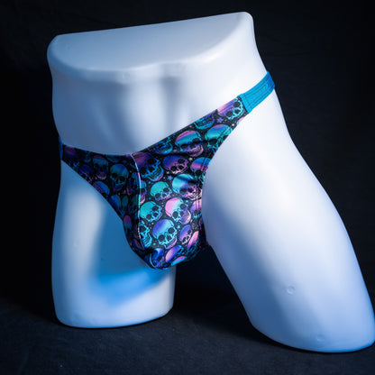 Men's purple and blue skulls thong underwear, classic cut, front view.