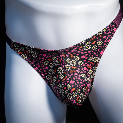 Men's purple floral thong underwear, classic cut, front view.