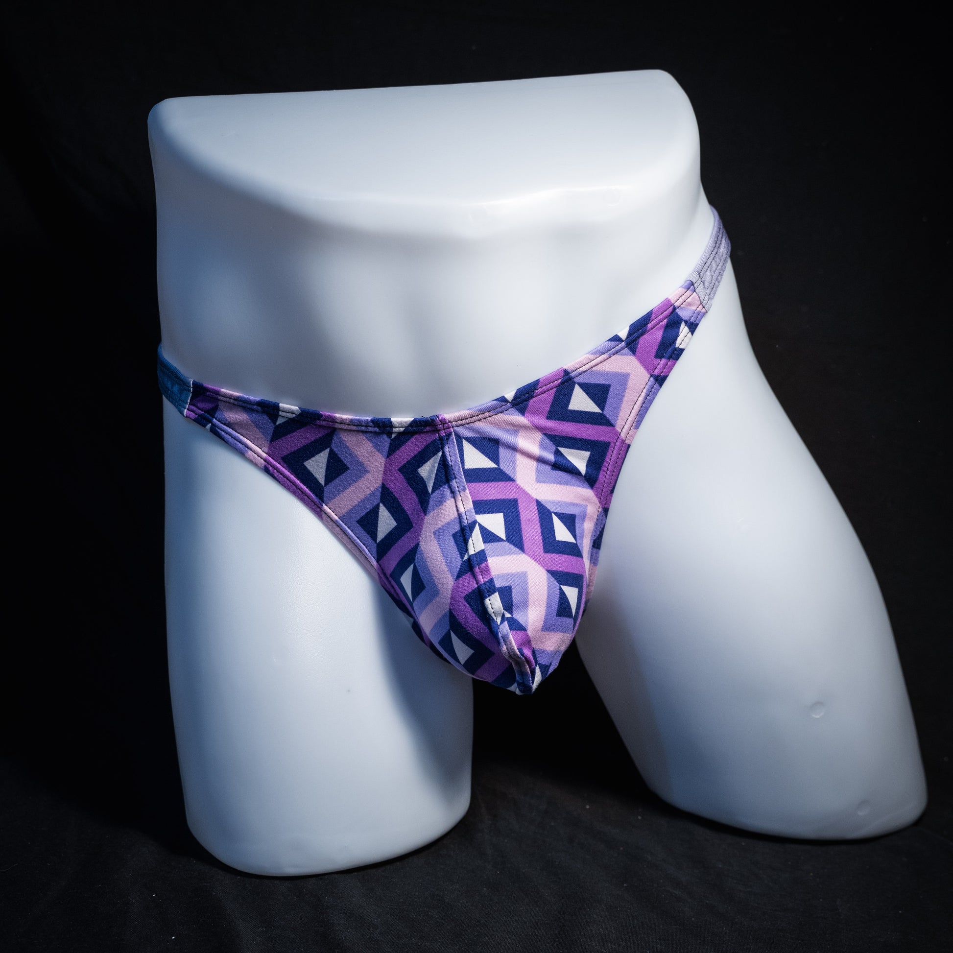 Men's purple geometric thong underwear, classic cut, front view.