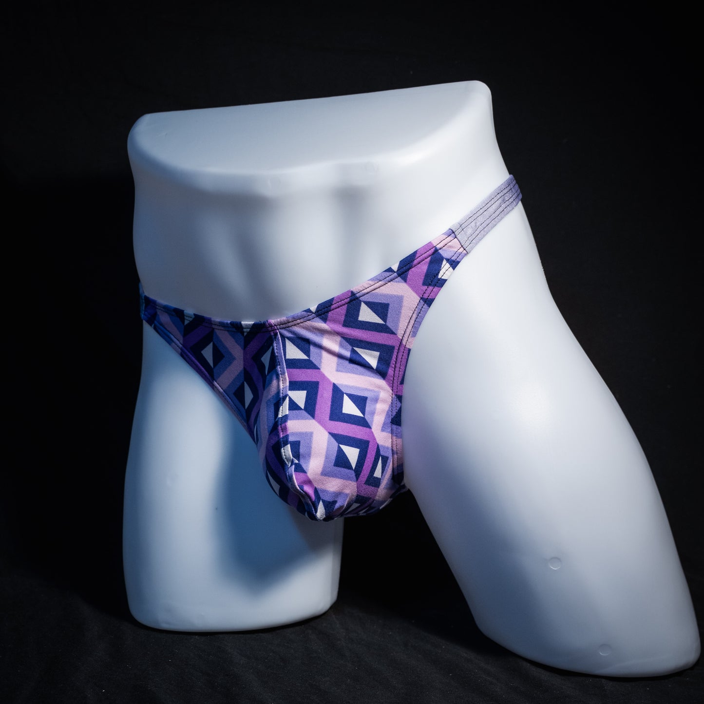 Men's purple geometric thong underwear, classic cut, front view.