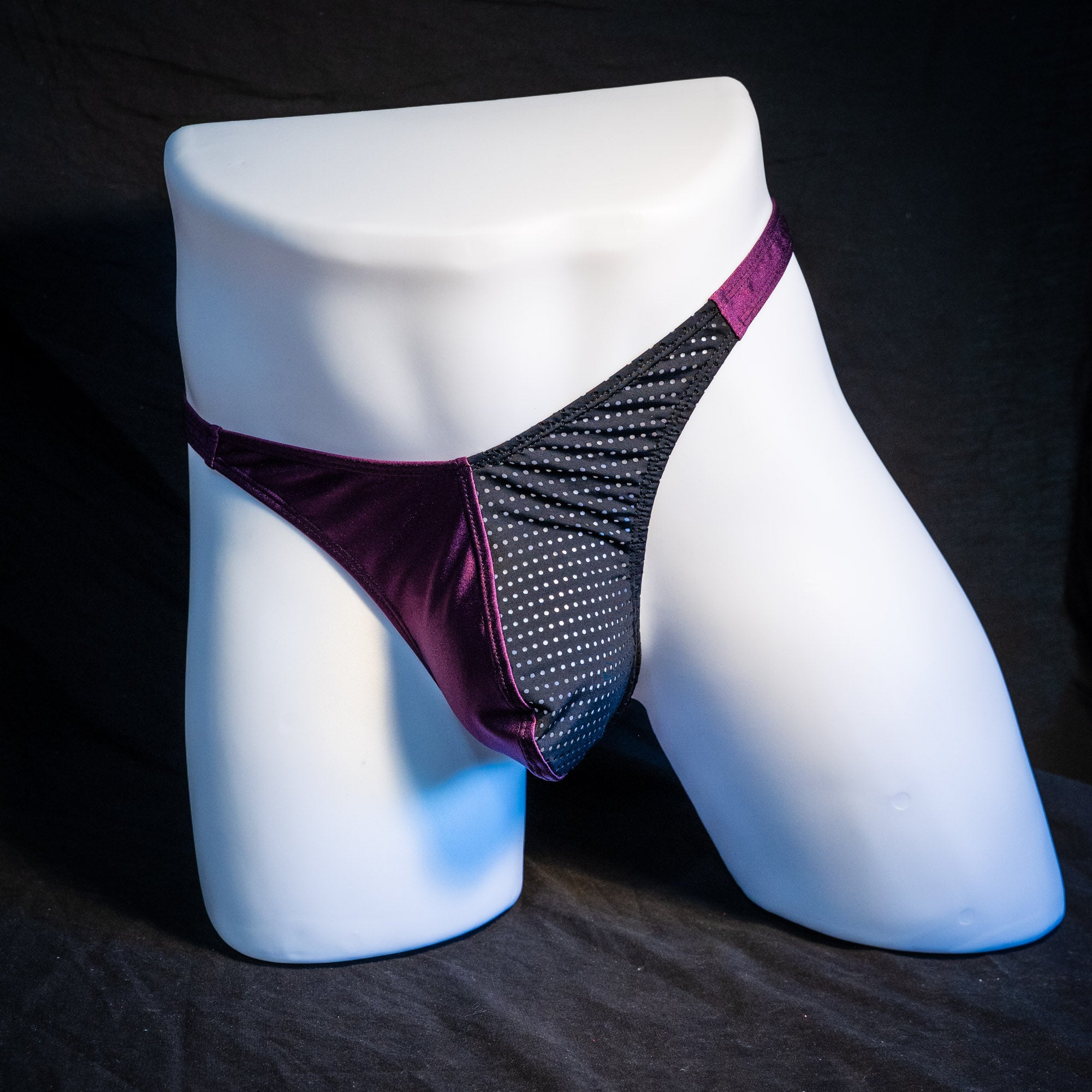 Men's half mesh and purple thong underwear, classic cut, full front angled view.