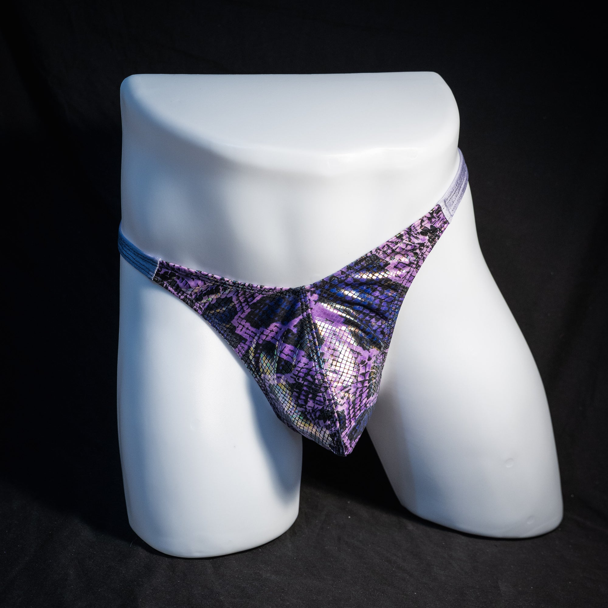 Men's purple metallic snakeskin thong underwear, classic cut, front view.