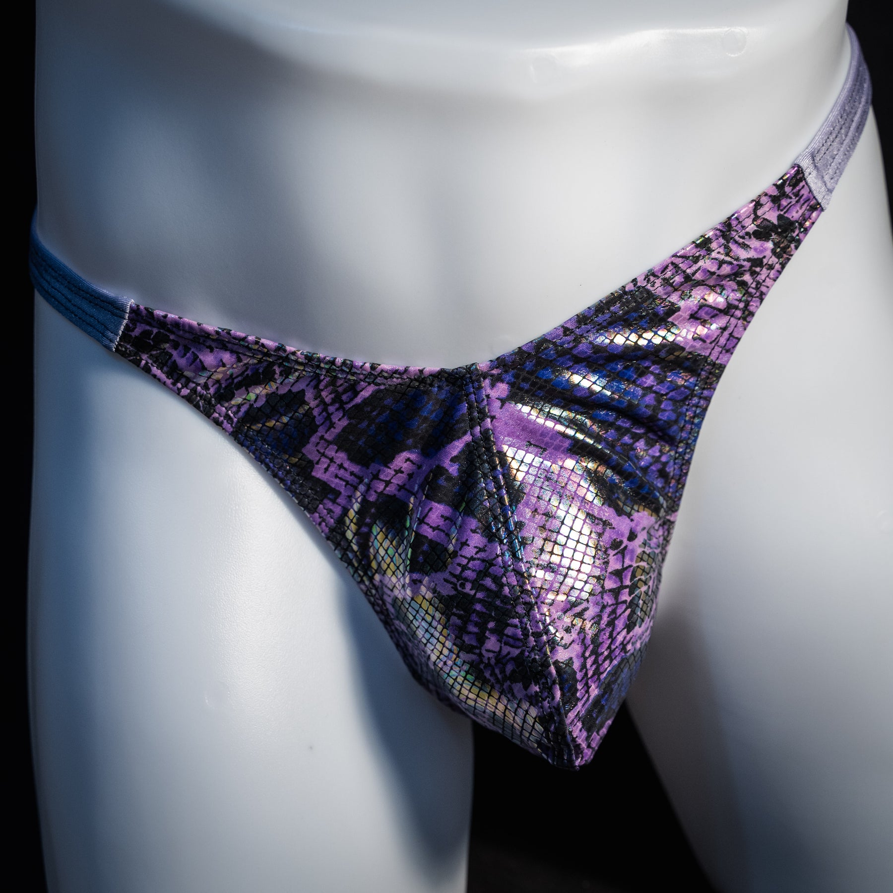 Men's purple metallic snakeskin thong underwear, classic cut, front view.